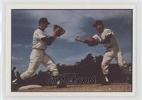 Bud Harrelson and Al Weis of Mets turn a double play