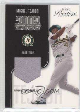 2003 Playoff Prestige - Player Collection Materials #_MITE - Miguel Tejada /325