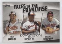 Trey Mancini, Cal Ripken Jr., Brooks Robinson