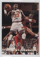 Patrick Ewing (Michael Jordan in Background)