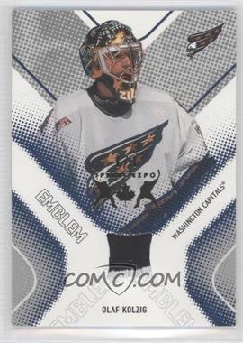 2002-03 In the Game Be A Player Between the Pipes - Game Used Emblem - Spring Expo #GUE-23 - Olaf Kolzig /1