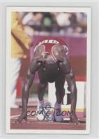 Carl Lewis (In starting blocks)