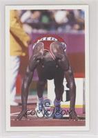 Carl Lewis (In starting blocks)