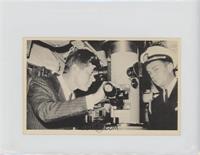 President Kennedy is shown at the periscope…