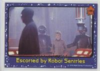 Escorted By Robot Sentries