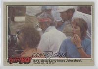 Bo's sister Kerry helps John shoot. (Face Puzzle Back) [Noted]