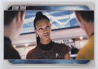 Uhura consults with Kirk, Captain Pike... [EX to NM]