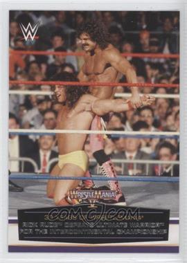 2014 Topps WWE Road to Wrestlemania - 30 Years of Wrestlemania #9 - Rick Rude Defeats Ultimate Warrior for the Intercontinental Championship