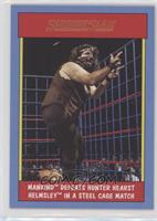 Mankind Defeats Hunter Hearst Helmsley in a Steel Cage Match